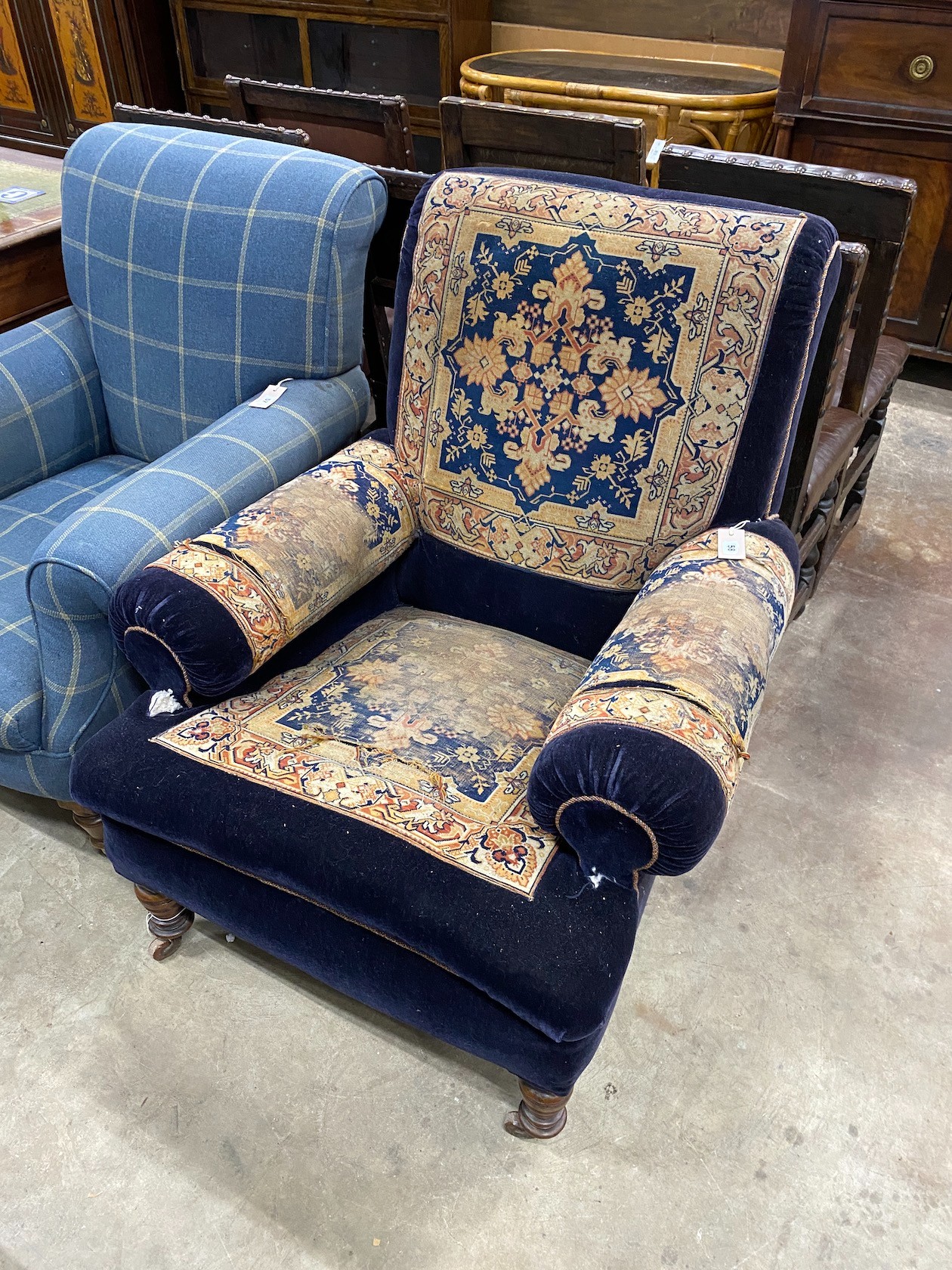 A Victorian saddlebag upholstered armchair, width 85cm, depth 92cm, height 97cm